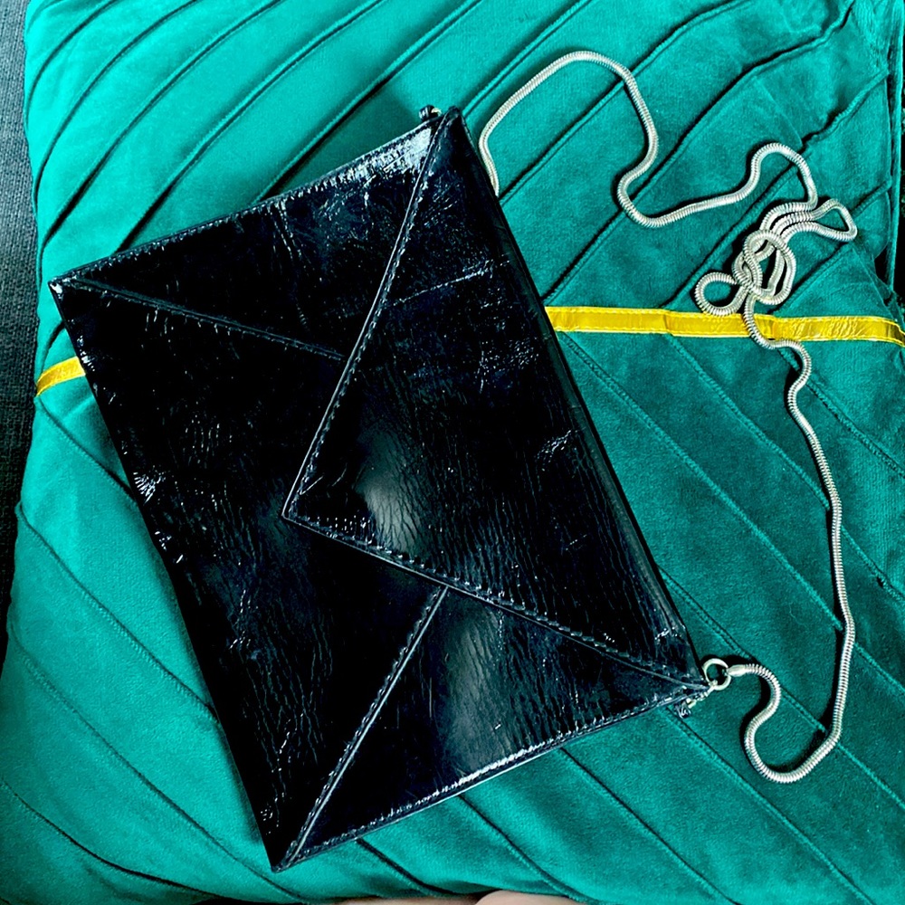 Small Faux leather Black Envelope crossbody with nice silver chain.